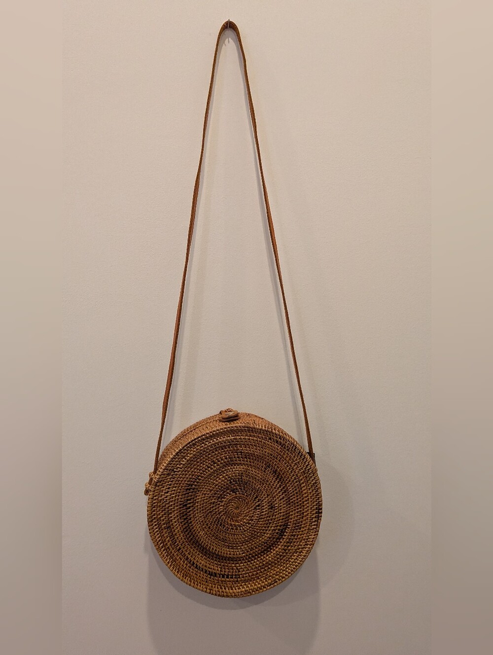 Handwoven Round Crossbody Bag in Natural Brown. Length Is 33in.